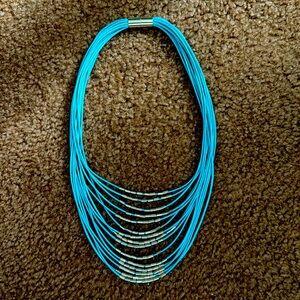 NWOT - Teal necklace with gold accents. Magnetic closure.